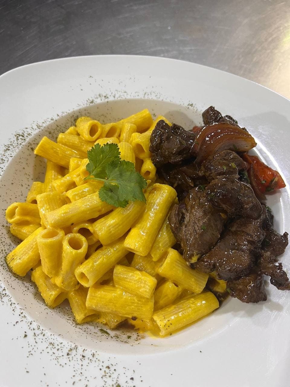 Rigatoni huanca y lomo